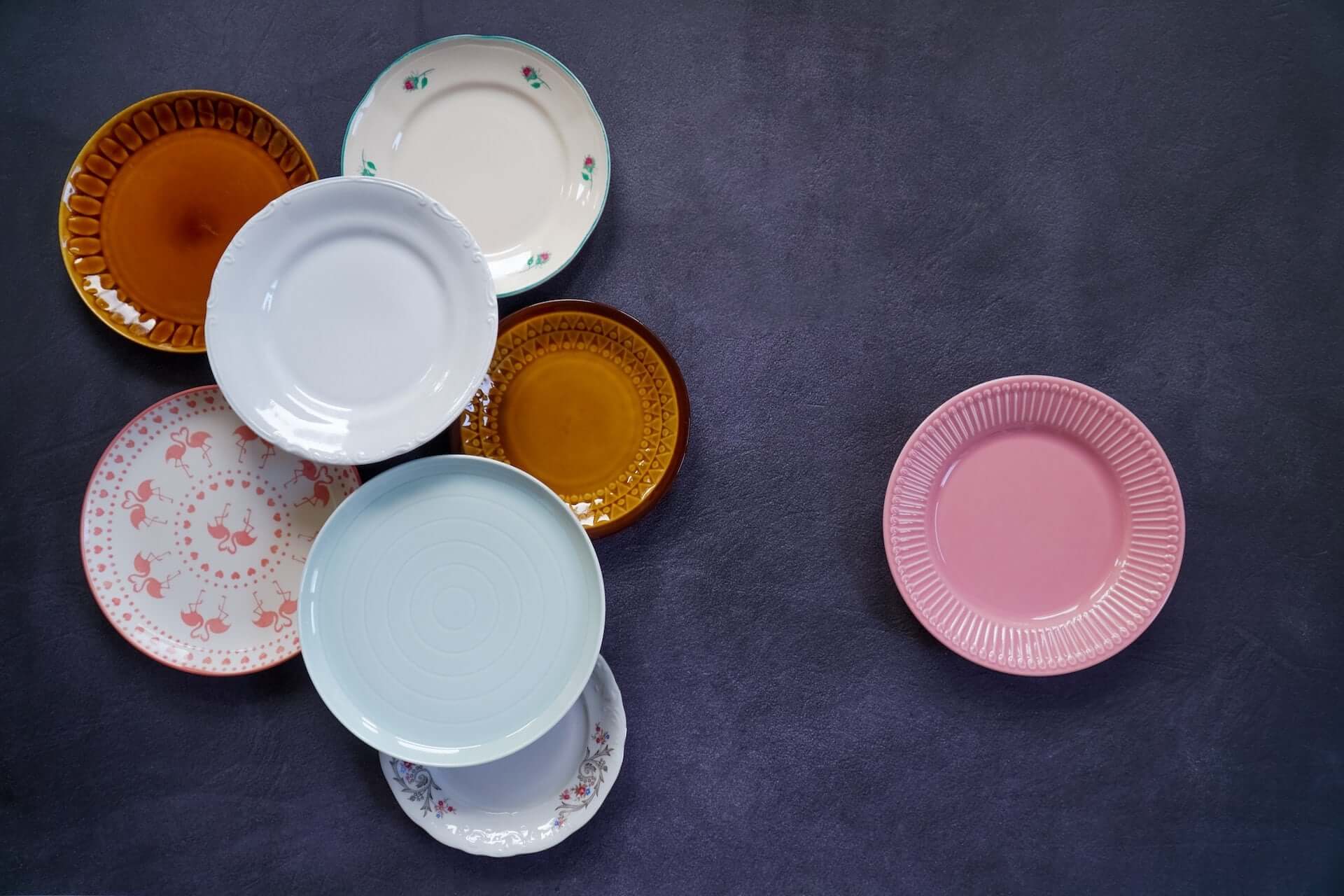 Colored plates laid out on a black background