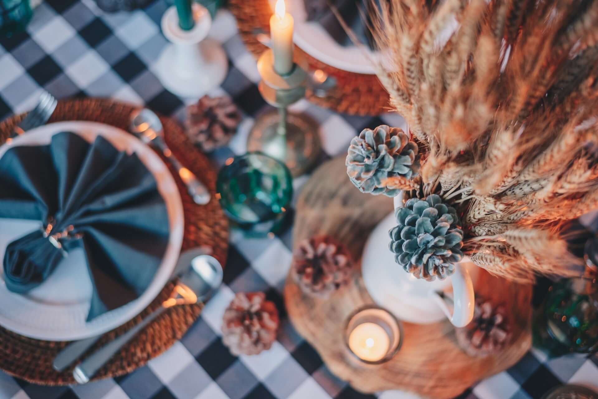 Thanksgiving dinner table setting with pampas and acorns