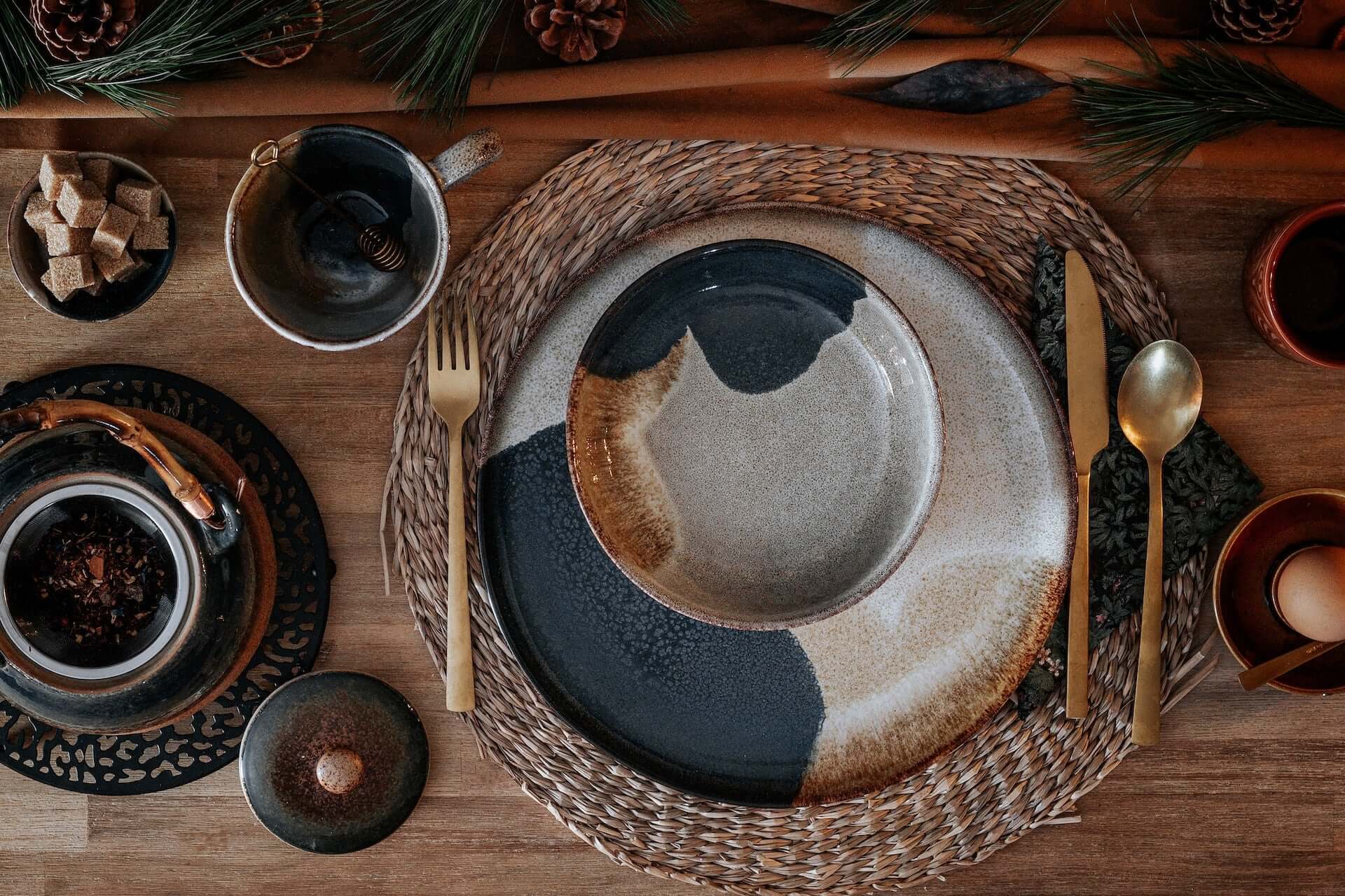 Table setting with printed dinner and charger plate and rattan placemat