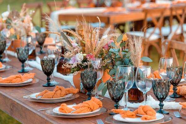 Dried pampas and mixed flowers in glass vases