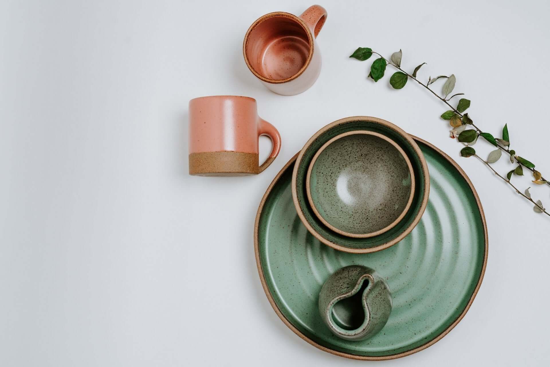 Green plate and salad bowl with tan cups